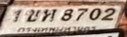 รูปป้าย 1ขห 8702 ที่ตัดจากรูปของผู้แจ้ง