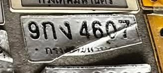 รูปป้าย 9กง 4607 ที่ตัดจากรูปของผู้แจ้ง
