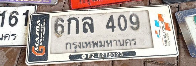 รูปป้าย 6กล 409 ที่ตัดจากรูปของผู้แจ้ง